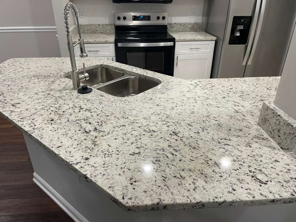 Immaculate granite kitchen island after professional cleaning
